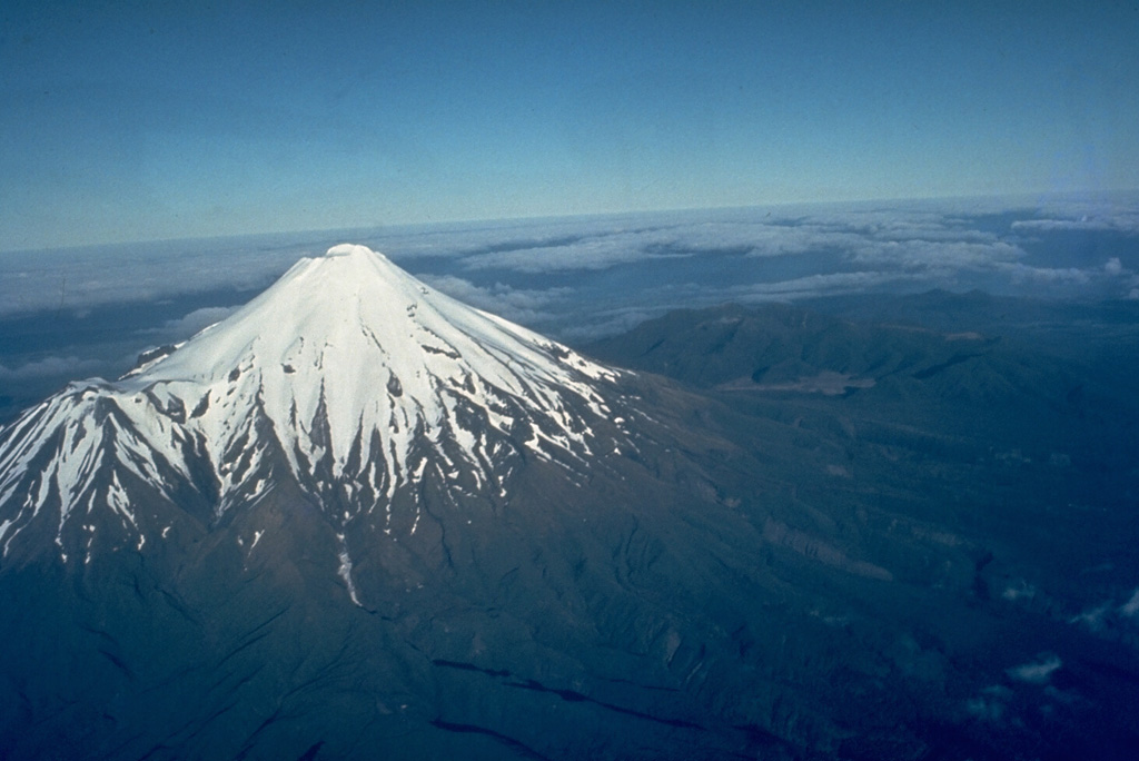 Taranaki volcano dominates the W coast of New Zealand's North Island. The stratovolcano, seen here from the S, is surrounded by a ring plain of debris avalanche and lahar deposits produced by repetitive collapse of the volcanic edifice. It has been active throughout the Holocene. The latest eruption of Taranaki took place in 1854 CE. Photo by Jim Cole (University of Canterbury).