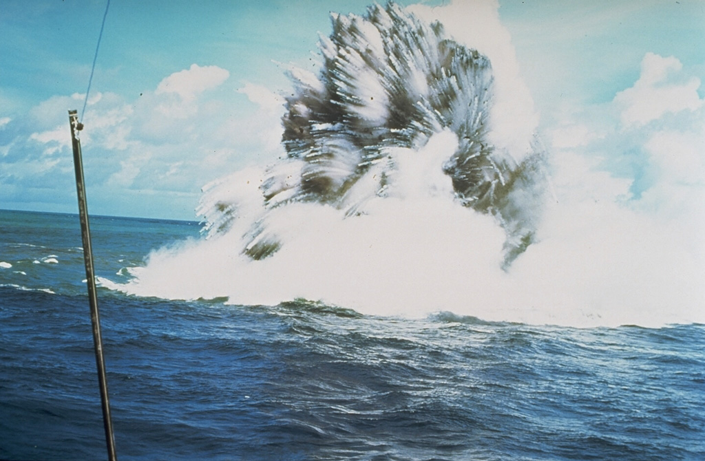 A shallow phreatomagmatic, or Surtseyan eruption from Kavachi volcano on 17 or 18 July 1977. Jets of dark ash can be seen emerging from white steam plumes. Numerous individual blocks ejected at high velocity are trailed by steam. Similar activity was observed from boats and airplanes for a period of less than one week. Photo by W.G. Muller, 1977 (Barrier Reef Cruises, Queensland, Australia; courtesy of R.W. Johnson).