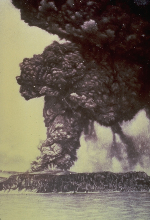 One week after the onset of an eruption of Krakatau volcano in May 1883, an eruption column rises above Perboewatan vent on Krakatau Island. Initially three vents on Krakatau Island were active. Three months later a paroxysmal eruption destroyed much of the island and formed a large caldera. Pyroclastic flows swept across the sea to Sumatra and tsunamis swept the coastlines of Sumatra and Java. Photo courtesy of the family of R. Breon, published in Simkin and Fiske (1983).