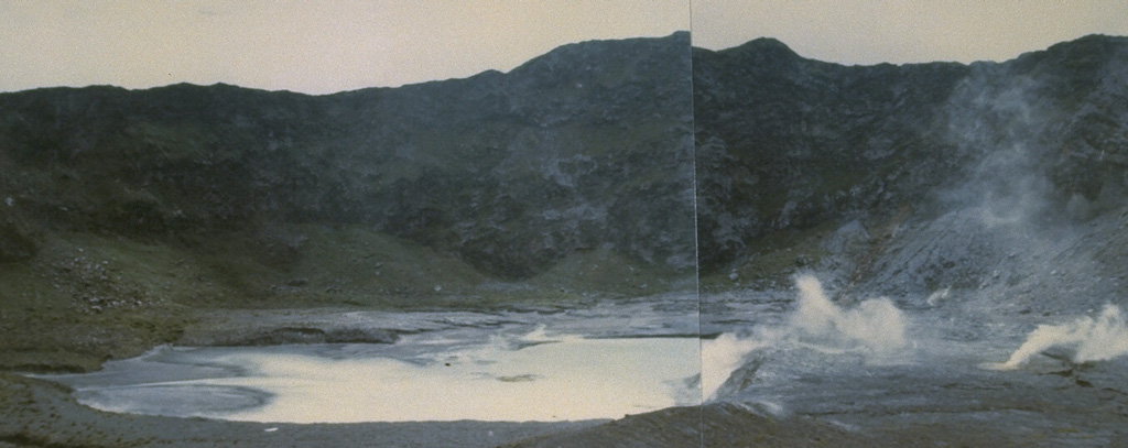 Fumaroles produce plumes along the floor and margins of Kawah Besar, a small crater with a shallow crater lake occupying Kaba Lama. This is the largest and westernmost of three major craters at the summit of Kaba volcano. The rim of 1.2-km-wide Kaba Lama forms the horizon. Photo by Deddy Rochendi, 1981 (Volcanological Survey of Indonesia).