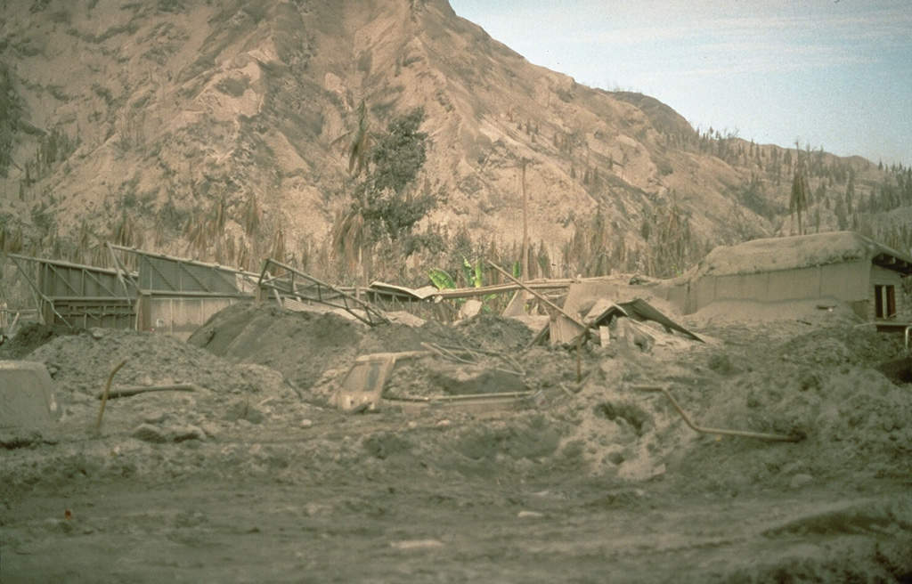 Thick deposits of ash from the 1994 eruption of Rabaul volcano covered the city of Rabaul, partially burying cars and houses. The eruption forced the abandonment of the town, once the largest on the island of New Britain, and a total of 53,000 people were evacuated from the city and surrounding areas. An estimated 30,000 people evacuated the day the eruption began, and the remainder left by land and by sea the following day. Photo by Andy Lockhart, 1994 (U.S. Geological Survey).