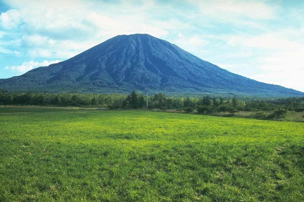 Yoteizan volcano, seen here from the NW, has deep radial valleys and a large crater at the summit with several smaller craters along the NW rim.  Photo by Ichiyo Moriya (Kanazawa University).