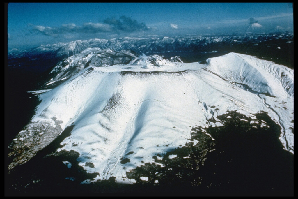 Tarumai volcano was constructed on the SE rim of the 13 x 15 km Shikotsu caldera. The summit has a small 1.5-km-wide caldera that formed during eruptions in 1667 and 1739 CE. It contains a flat-topped summit lava dome that was extruded in 1909. Two other Holocene post-caldera volcanoes occur at Shikotsu, Fuppushi (adjacent to Tarumai) and Eniwa, on the opposite side of the caldera. Photo by Ichio Moriya (Kanazawa University).