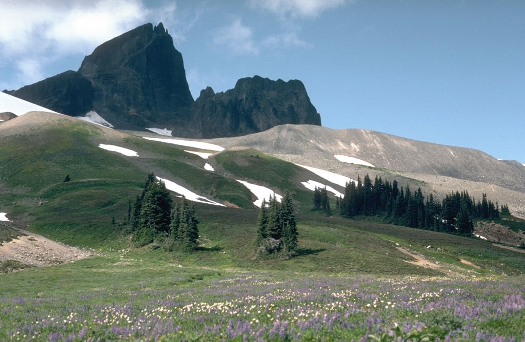 Black Tusk is a glacially eroded lava dome from the earliest stage of activity of the Garibaldi Lake volcanic field about 1 million years ago. The light-colored ridge to the right is a glacial moraine. Photo by Lee Siebert, 1983 (Smithsonian Institution).