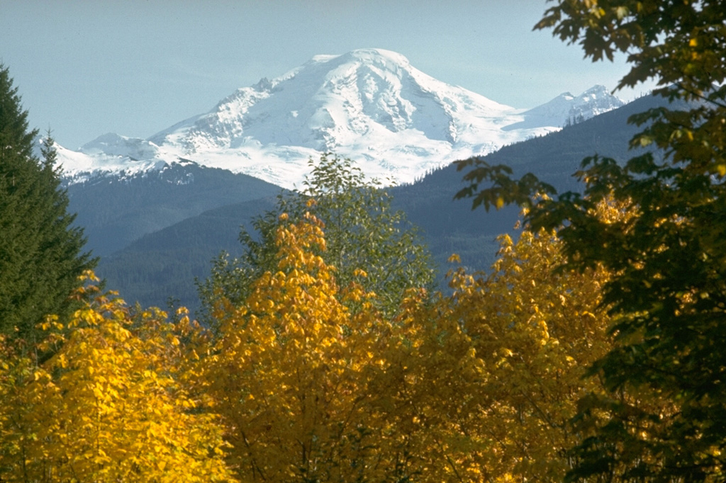 Glaciated Mount Baker rises above the North Fork Nooksack River valley below the NW flank. Photo by Lee Siebert, 1973 (Smithsonian Institution).