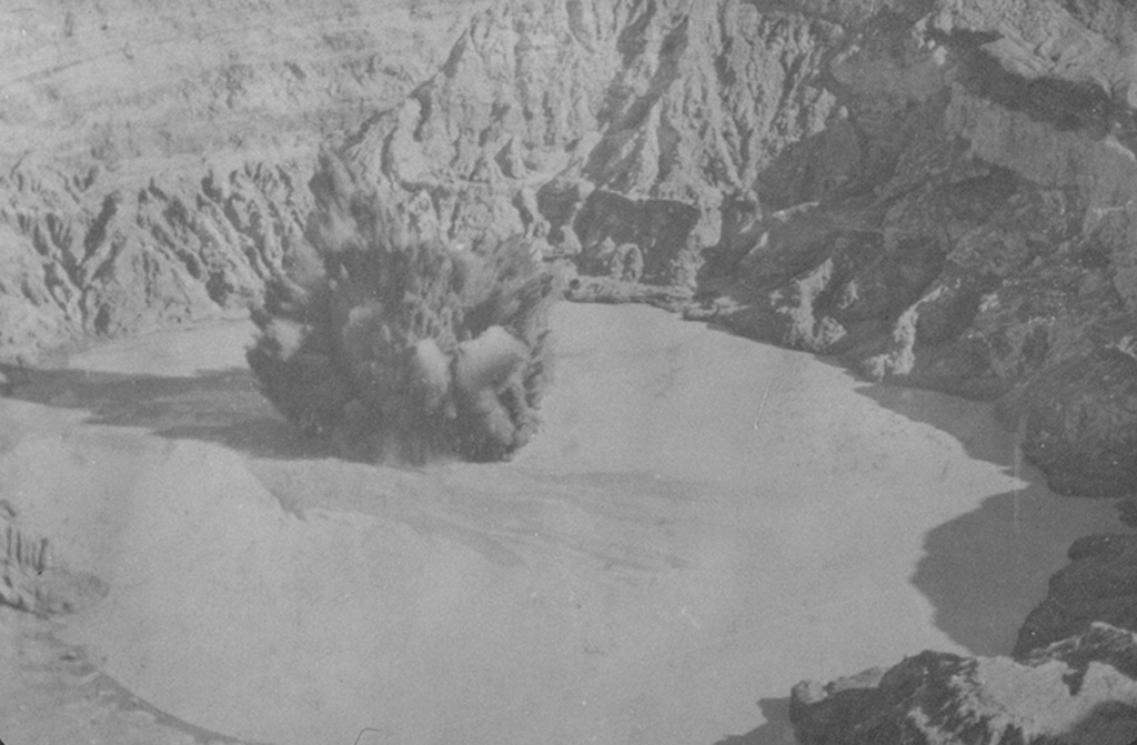 An ash plume rises above the crater lake of Poás volcano in 1915. Intermittent eruptions producing ashfall during 8 October 1914 to 15 May 1915. The 10 April eruption was seen from San José, and the last of a series of eruptions during 15-19 April that produced ashfall across great distances. Photo by R. Fernandez Peralta, 1915 (courtesy of Jorge Barquero, Universidad Nacional Costa Rica).