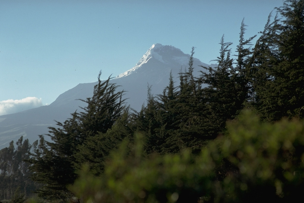 Illiniza Sur, seen here from the Interandean valley to its east, is the highest of the twin peaks of Illiniza volcano.  A lava dome on its southern flank, Rasuyacu, erupted during the Holocene.  Illiniza itself may have had relatively youthful eruptions, although none have been dated. Photo by Lee Siebert, 1978 (Smithsonian Institution).