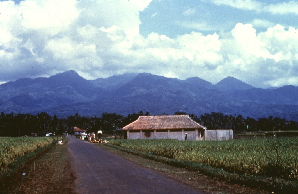 Kawah Karaha, seen here from the SW, is an eroded Quaternary volcanic complex at the northern end of a chain of volcanoes extending north from Galunggung volcano.  The forested complex is known for the Kawah Karaha fumarole field, which is located along the Cipanas stream.  The fumarole field covers an area of 250 x 80 m and contains a sulfur deposit.  The age of the most recent eruption of Kawah Karaha is not known. Anonymous, 1985.