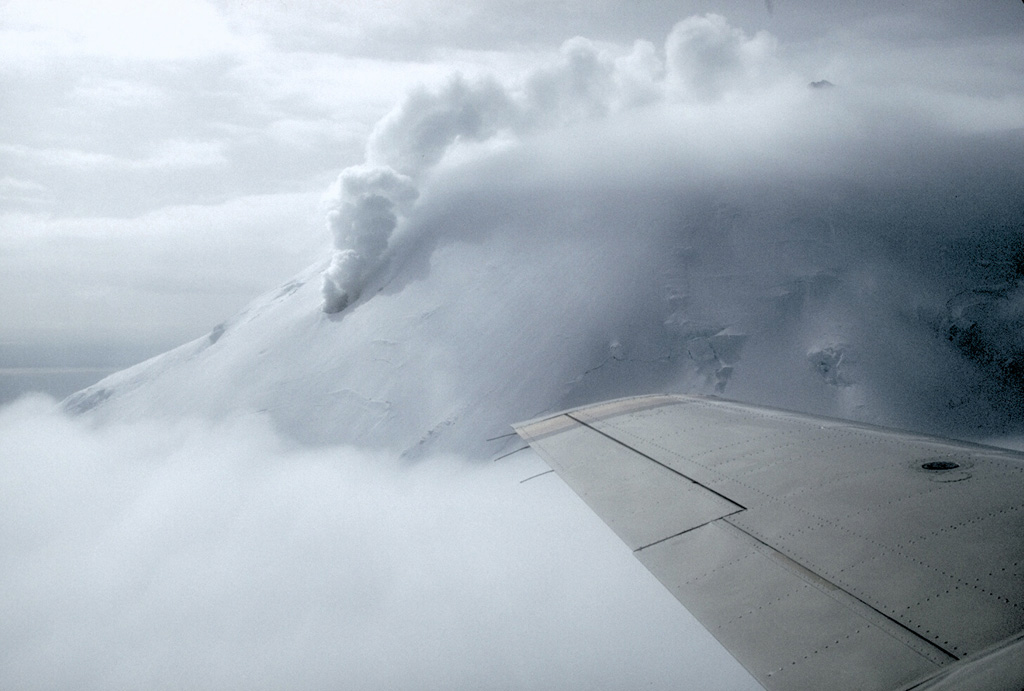 A large steam column rises from a fumarole at about 1,600 m elevation on the N flank of Chiginagak volcano on the Alaska Peninsula in May 1994. Strong steam emission is a common occurrence at this volcano and can be mistaken for eruptive activity. Photo by Chris Nye, 1994 (Alaska Division of Geological and Geophysical Surveys).