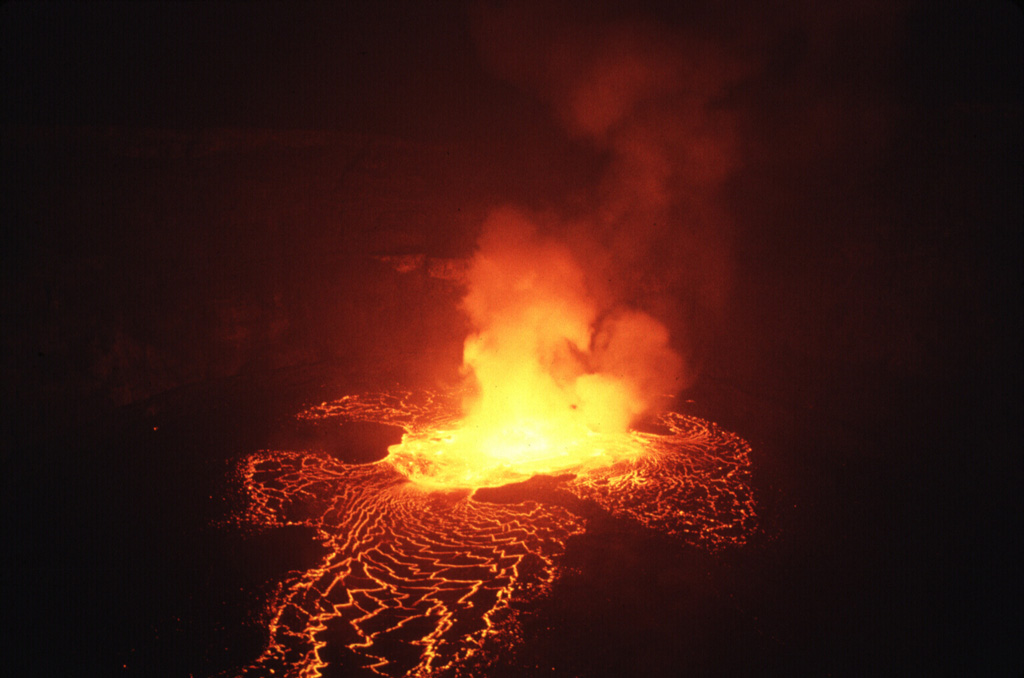 Lava lake activity seen here on 21 August, began the night of 22-23 June 1994. Lava fountain height reached 30-40 m and the lava lake level was 5-10 m below the height of the 1982 lava lake. Lava lake activity continued until at least September 1995, with accumulation of lava on the crater floor from the end of April to mid-August 1995 causing the crater floor level to rise about 50 m. Observers saw nighttime glow from the crater in November 1995 and February-March 1996. Photo by Jack Lockwood, 1994 (U.S. Geological Survey).