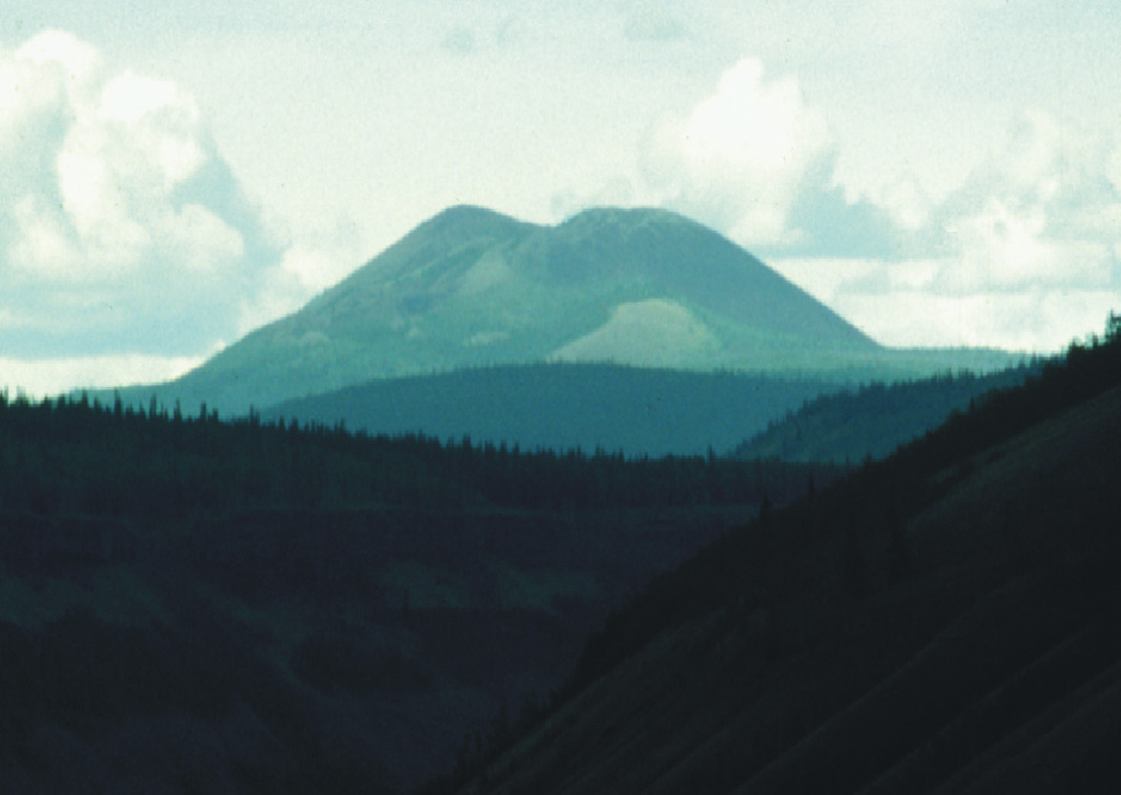 Volcano Mountain is a cone within the Fort Selkirk volcanic field in the central Yukon Territory, near the junction of the Yukon and Pelly rivers, and is Canada's northernmost Holocene volcano. Volcano Mountain comprises a scoria cone and a series of lava flows that traveled to the NE and SW.  Photo by Lionel Jackson (Geological Survey of Canada).