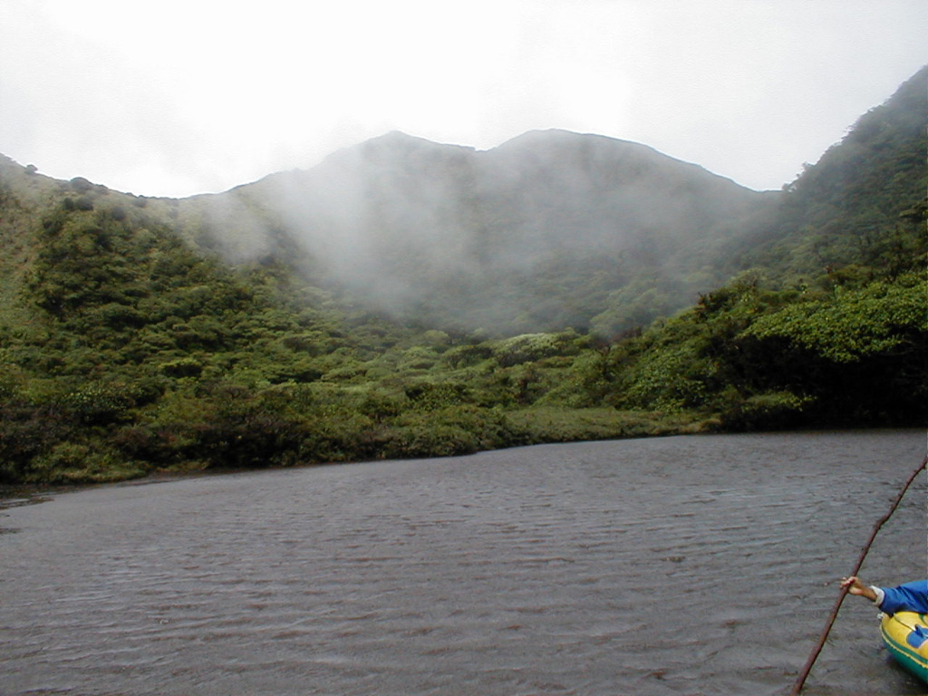 Wispy clouds cling to the walls of Tenorio's crater lake.  This densely forested volcano provides habitat for some of Costa Rica's most exotic wildlife, including pumas, jaguars, tapirs, and a wide variety of bird life.  Heavy rainfall in this forested terrain feeds crystalline waters that are important in regional hydrology. Photo by Eliecer Duarte (OVSICORI-UNA).