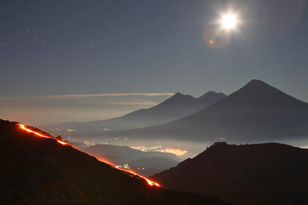 This time-lapse night view of Pacaya's MacKenney cone is looking towards the W in December 2007. The lower-relief Cerro Chino of the Pacaya complex in the right foreground, and in the background from right to left are Volcán de Agua, Acatenango, and Fuego. Photo courtesy of Richard Roscoe (www.photovolcanic.com).