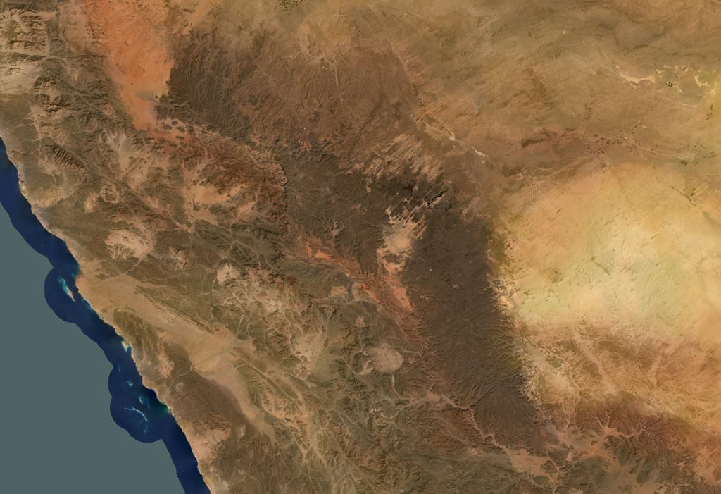 Harrat ar Rahah-'Uwayrid is the northernmost of a series of Quaternary volcanic fields paralleling the Red Sea coast of Saudi Arabia, south of the city of Tabuk. The olivine basaltic field extends NW-SE about 240 km overall, and contains numerous scoria cones, tuff cones, and associated lava fields. Satellite image courtesy of Planet Labs Inc., 2020 (https://www.planet.com/).