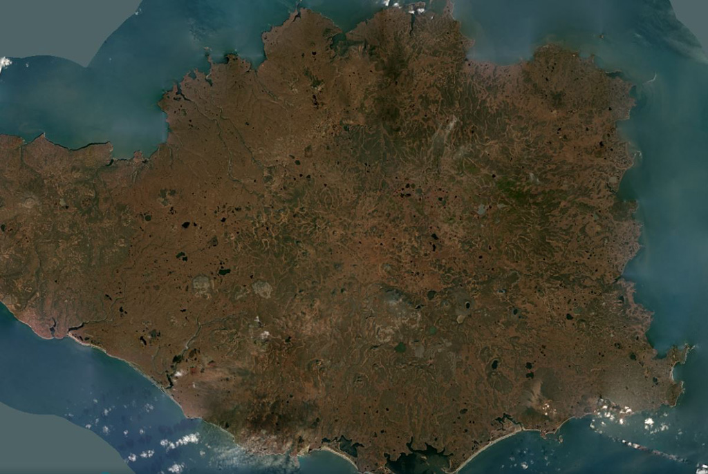 The 108-km-wide Nunivak Island volcanic field in the Bering Sea off Alaska is shown in this October 2019 Planet Labs satellite image monthly mosaic (N is at the top; this image is approximately 96 km across). There are around 60 scoria cones and four maars across the island, with lava flows 3-15 m thick and less than 3.5 km long forming much of the Island surface. Satellite image courtesy of Planet Labs Inc., 2019 (https://www.planet.com/).