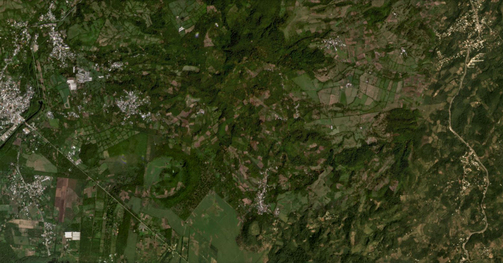 The Lake Yojoa volcanic field in Honduras is located along the northern shore of Lake Yojoa, shown in this October 2019 Planet Labs satellite image monthly mosaic (N is at the top; this image is approximately 12 km across). The field contains scoria and spatter cones and lava flows, with the Cerro el Hoyo in the bottom-center, to the W is the smaller Cerro el Copito cone on the other side of the larger unnamed crater, and Cerro Babilonia in the center of the top of the image. Satellite image courtesy of Planet Labs Inc., 2019 (https://www.planet.com/).