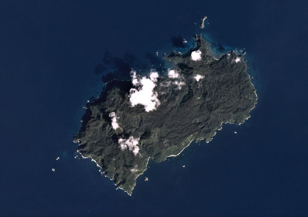 The 22 km2 Isla del Coco (Cocos Islands) is the subaerial portion of the Cocos Ridge, shown in this December 2019 Planet Labs satellite image monthly mosaic (N is at the top). A Pliocene-Pleistocene shield volcano partly forms the roughly 7-km-long (in the NE-SW direction) island. Steep cliffs around the coast expose thick columnar-jointed lava flows, thin lavas, and breccias (possibly debris flows). Satellite image courtesy of Planet Labs Inc., 2019 (https://www.planet.com/).