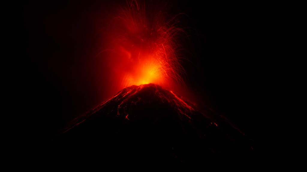 Incandescent bombs ejected from Fuego’s summit vent impact the upper flanks on 20 February 2020. The ballistic trajectories are visible at night with initial velocities reaching several hundred meters per second. This photo is taken from Observatorio del Volcán de Fuego (OVFGO), Panimaché Uno, Chimaltenango, below the SW flank. Photo by Ailsa Naismith, 2020.