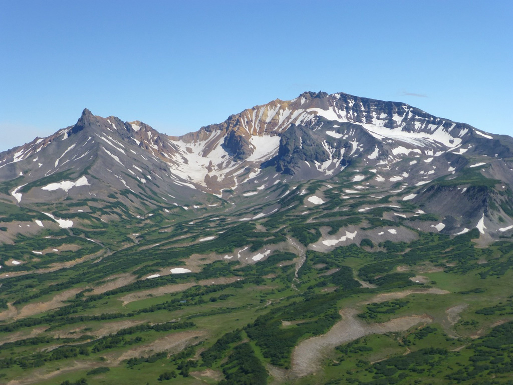 The extensively eroded western flank of Dzenzursky is seen here. The majority of the edifice formed during the Pleistocene. Photo by Janine Krippner, 2014.